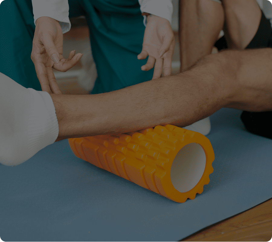 Physical therapy with orange foam roller